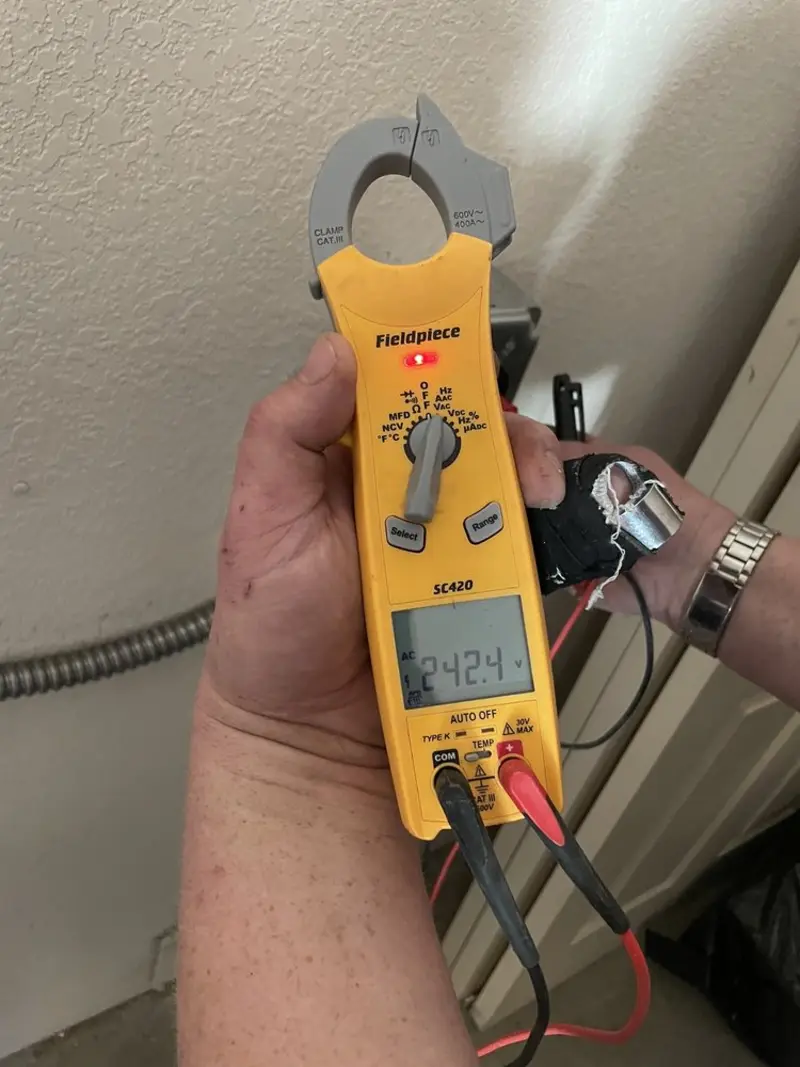 Voltage testing with clamp meter during Outlet Installation in Hyde Park
